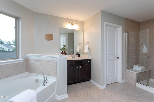 4026 Overcup Oak Ln, Cary, NC 27519 - full bath with vanity, a garden tub, a shower stall, tile patterned floors, and baseboards