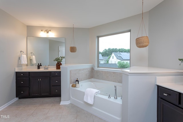 4026 Overcup Oak Ln, Cary, NC 27519 - bathroom featuring vanity, a bath, tile patterned floors, and baseboards