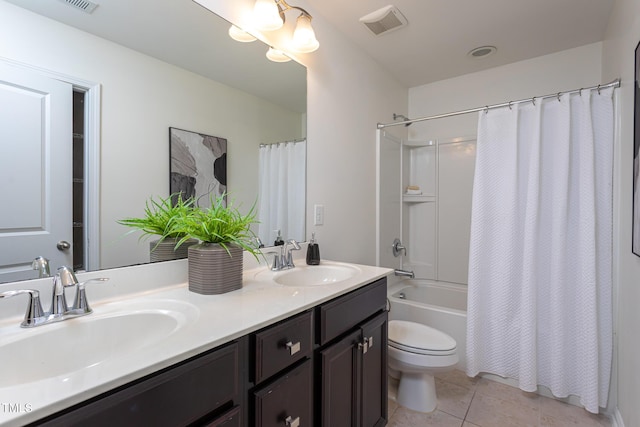 4026 Overcup Oak Ln, Cary, NC 27519 - bathroom with double vanity, shower / bath combo with shower curtain, toilet, and tile patterned flooring