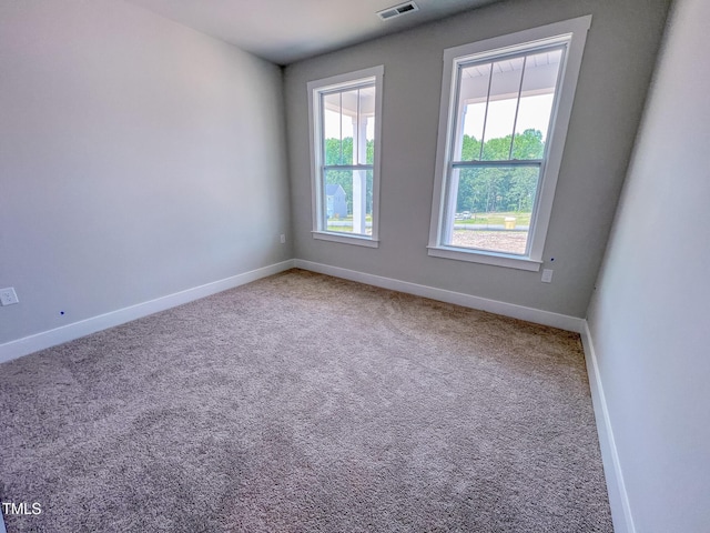 217 Duncan Creek Rd # 124, Lillington, NC 27546 - carpeted spare room featuring baseboards