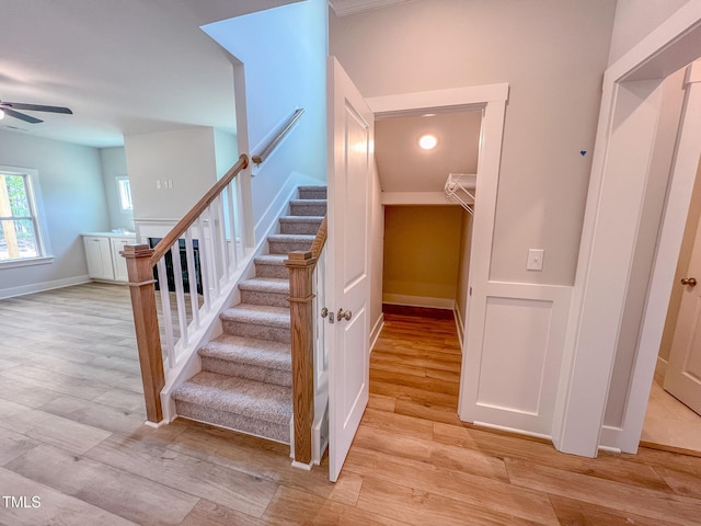 217 Duncan Creek Rd # 124, Lillington, NC 27546 - stairway with wood finished floors, a ceiling fan, and baseboards