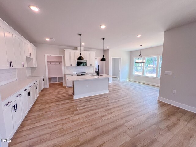 217 Duncan Creek Rd # 124, Lillington, NC 27546 - kitchen featuring stainless steel appliances, a sink, tasteful backsplash, recessed lighting, and white cabinets