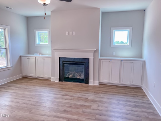 217 Duncan Creek Rd # 124, Lillington, NC 27546 - unfurnished living room with light wood-style flooring, a fireplace, baseboards, and ceiling fan
