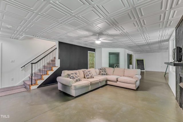 85 Christenbury Ln, Clayton, NC 27527 - living room featuring stairway, an ornate ceiling, a ceiling fan, and concrete floors