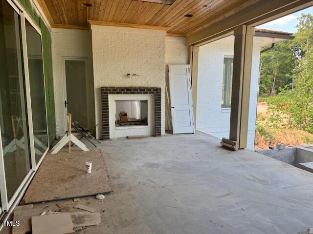 1216 Barcroft Pl, Raleigh, NC 27615 - view of patio with an outdoor brick fireplace
