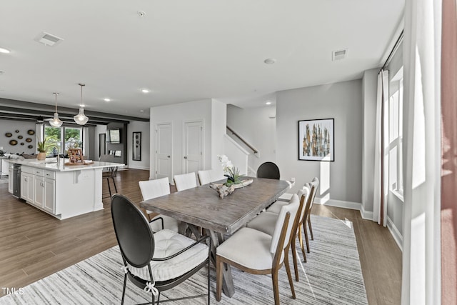1245 S Blount St Unit 201, Raleigh, NC 27601 - dining area with visible vents, stairway, recessed lighting, and dark wood finished floors