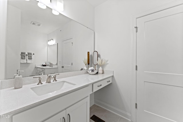 1245 S Blount St Unit 201, Raleigh, NC 27601 - bathroom featuring tile patterned floors, vanity, baseboards, and visible vents
