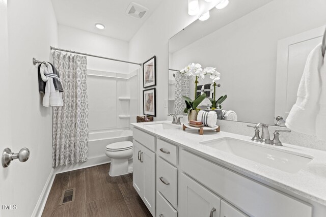 1245 S Blount St Unit 201, Raleigh, NC 27601 - full bathroom with a sink, visible vents, double vanity, and wood finished floors