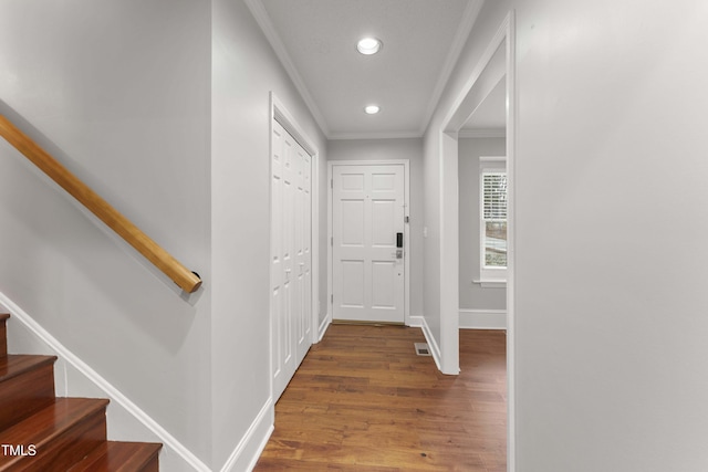 2949 Tram Rd, Fuquay Varina, NC 27526 - hallway featuring stairway, recessed lighting, ornamental molding, baseboards, and wood finished floors