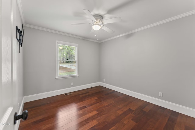 2949 Tram Rd, Fuquay Varina, NC 27526 - empty room with visible vents, baseboards, ceiling fan, ornamental molding, and dark wood-type flooring
