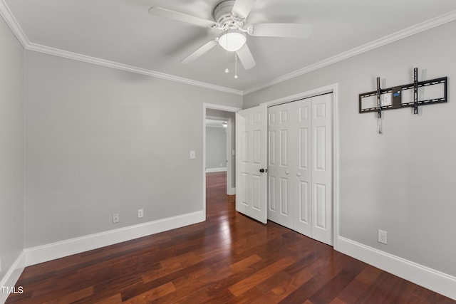 2949 Tram Rd, Fuquay Varina, NC 27526 - unfurnished bedroom featuring baseboards, ornamental molding, wood finished floors, and a closet