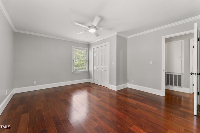 2949 Tram Rd, Fuquay Varina, NC 27526 - unfurnished bedroom featuring crown molding, a closet, wood finished floors, baseboards, and visible vents