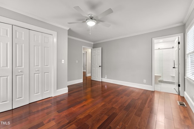 2949 Tram Rd, Fuquay Varina, NC 27526 - unfurnished bedroom featuring a closet, ornamental molding, visible vents, and wood finished floors