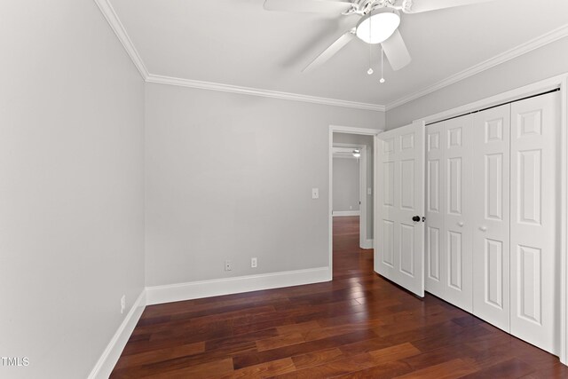 2949 Tram Rd, Fuquay Varina, NC 27526 - unfurnished bedroom with a closet, crown molding, baseboards, wood finished floors, and a ceiling fan