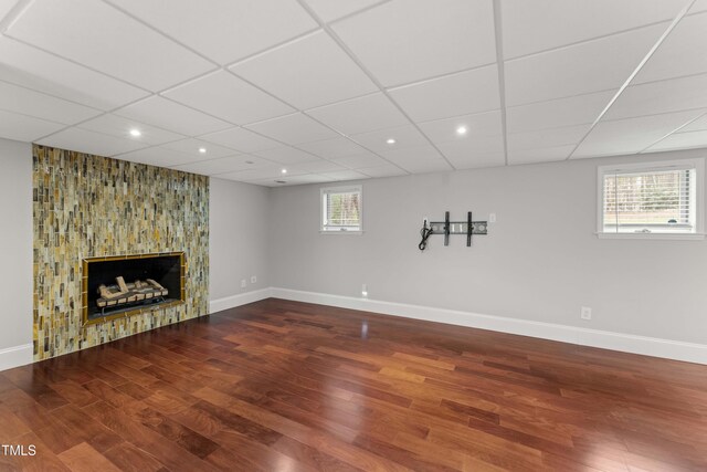 2949 Tram Rd, Fuquay Varina, NC 27526 - basement with a fireplace, wood finished floors, baseboards, recessed lighting, and a paneled ceiling