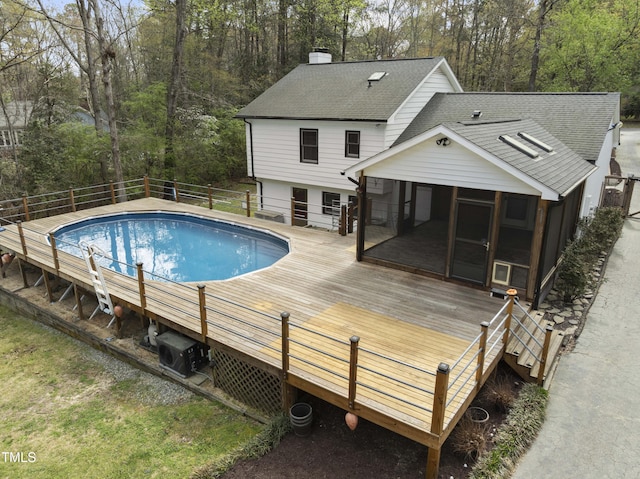2949 Tram Rd, Fuquay Varina, NC 27526 - view of pool featuring a sunroom, a deck, and a fenced in pool
