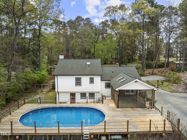 2949 Tram Rd, Fuquay Varina, NC 27526 - view of swimming pool with a wooden deck, fence, and a fenced in pool