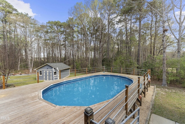 2949 Tram Rd, Fuquay Varina, NC 27526 - view of pool featuring fence, a wooden deck, a fenced in pool, a storage structure, and an outbuilding