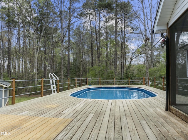2949 Tram Rd, Fuquay Varina, NC 27526 - view of swimming pool with a fenced in pool and a wooden deck
