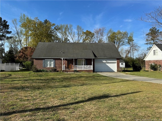 5870 Mcdonald Rd, Parkton, NC 28371 - single story home with covered porch, brick siding, concrete driveway, and a garage