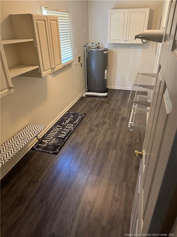 5870 Mcdonald Rd, Parkton, NC 28371 - laundry room with cabinet space, dark wood-style flooring, washer hookup, baseboards, and electric water heater