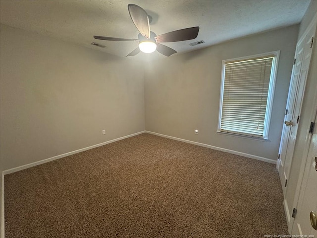 5870 Mcdonald Rd, Parkton, NC 28371 - empty room with carpet flooring, a ceiling fan, and visible vents