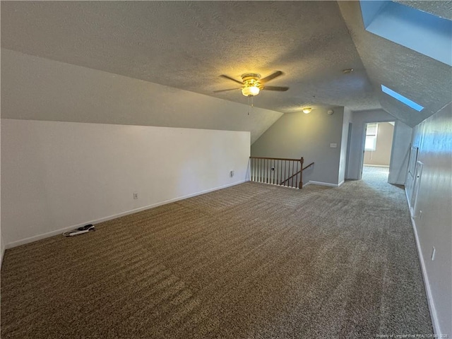 5870 Mcdonald Rd, Parkton, NC 28371 - additional living space with carpet floors, a ceiling fan, a textured ceiling, and lofted ceiling