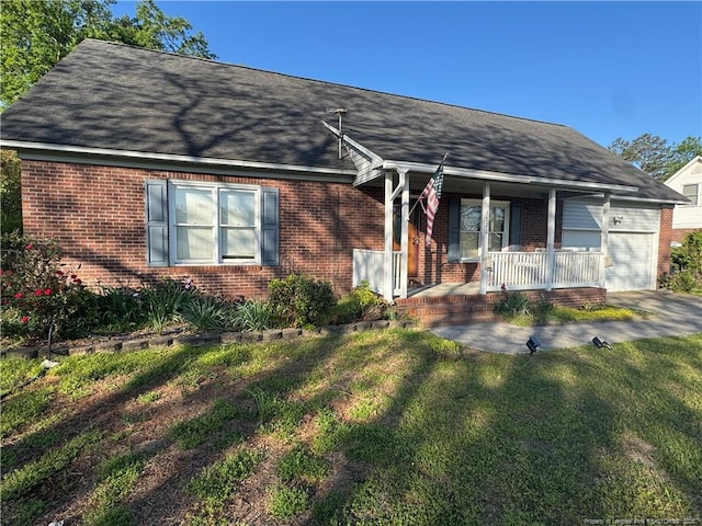 5870 Mcdonald Rd, Parkton, NC 28371 - ranch-style home featuring an attached garage, a porch, and brick siding