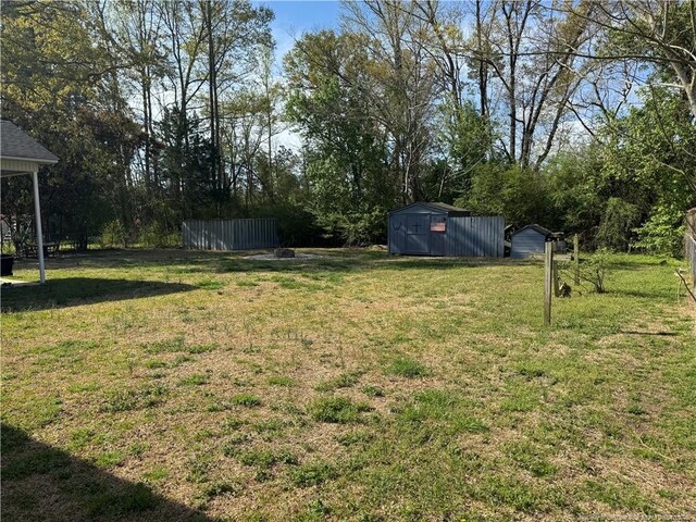 5870 Mcdonald Rd, Parkton, NC 28371 - view of yard featuring an outbuilding and a shed