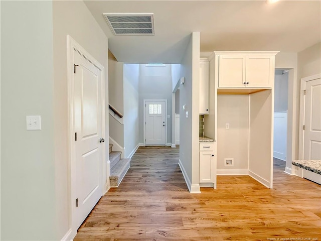 1312 Cory Cir, Fayetteville, NC 28312 - interior space with stairway, visible vents, baseboards, and light wood finished floors