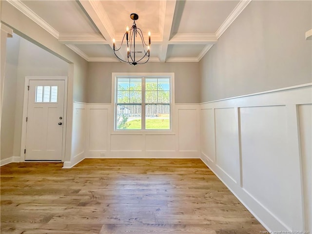 1312 Cory Cir, Fayetteville, NC 28312 - unfurnished dining area featuring coffered ceiling, a notable chandelier, a decorative wall, and a wealth of natural light
