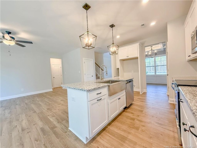 1312 Cory Cir, Fayetteville, NC 28312 - kitchen with visible vents, electric range, white cabinets, a sink, and dishwasher