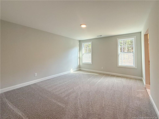 1312 Cory Cir, Fayetteville, NC 28312 - unfurnished room featuring baseboards, light colored carpet, and visible vents