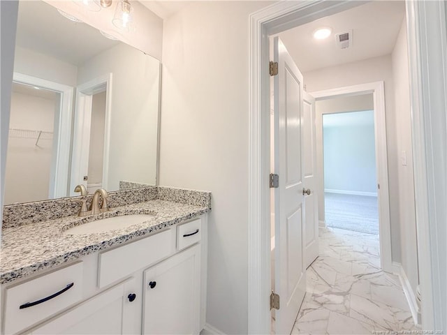 1312 Cory Cir, Fayetteville, NC 28312 - bathroom featuring visible vents, marble finish floor, baseboards, and vanity