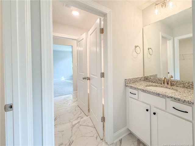 1312 Cory Cir, Fayetteville, NC 28312 - bathroom with vanity, marble finish floor, and baseboards