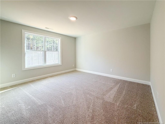 1312 Cory Cir, Fayetteville, NC 28312 - spare room featuring carpet floors, baseboards, and visible vents