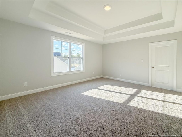 1312 Cory Cir, Fayetteville, NC 28312 - unfurnished room with a tray ceiling, light carpet, and baseboards