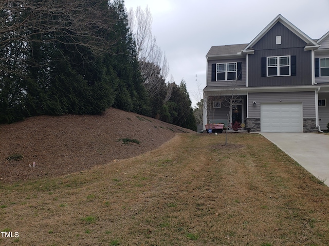 17 Verona Dr, Clayton, NC 27527 - view of front of property with a garage, driveway, stone siding, and a front lawn