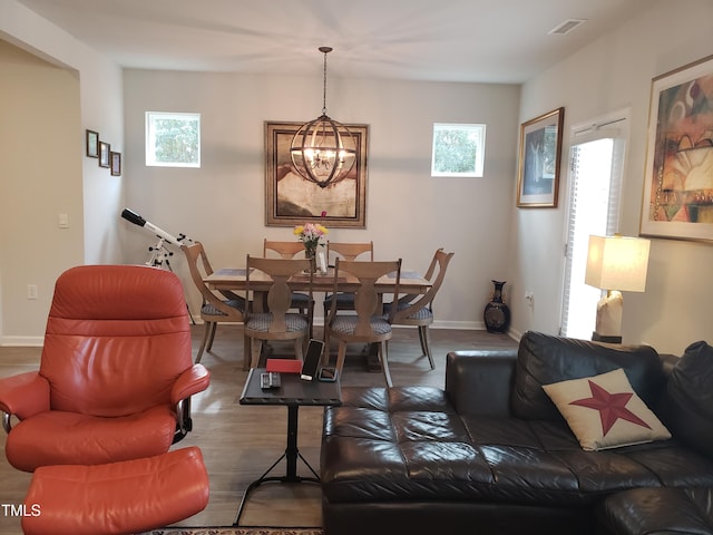 17 Verona Dr, Clayton, NC 27527 - dining room featuring plenty of natural light, a notable chandelier, visible vents, and wood finished floors