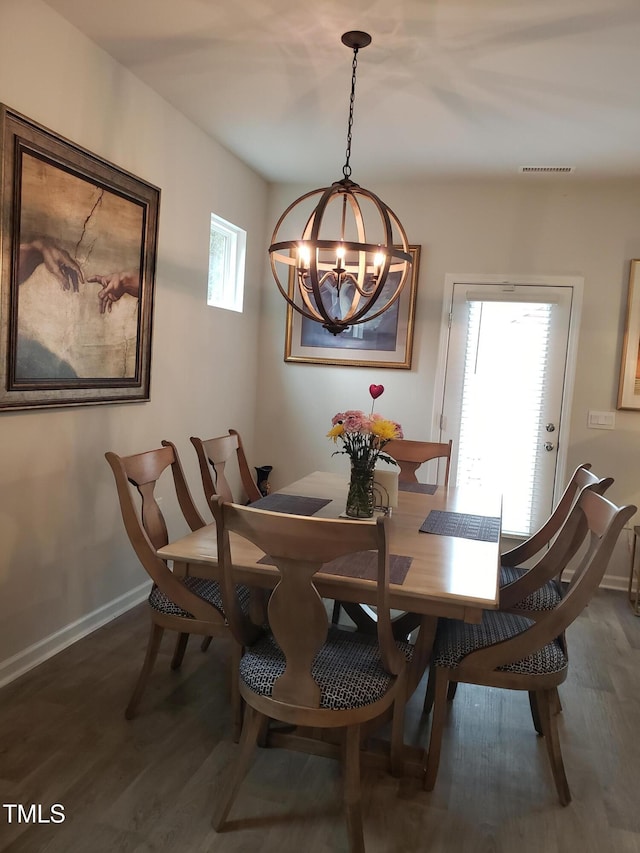 17 Verona Dr, Clayton, NC 27527 - dining room with a notable chandelier, baseboards, visible vents, and wood finished floors