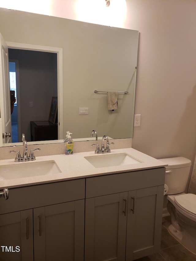 17 Verona Dr, Clayton, NC 27527 - bathroom featuring a sink, toilet, double vanity, and tile patterned flooring