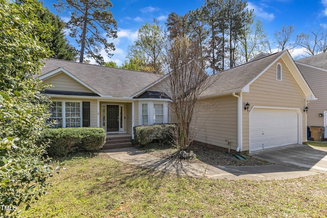 9512 Anson Grove Ln, Raleigh, NC 27615 - ranch-style house with driveway, an attached garage, and roof with shingles