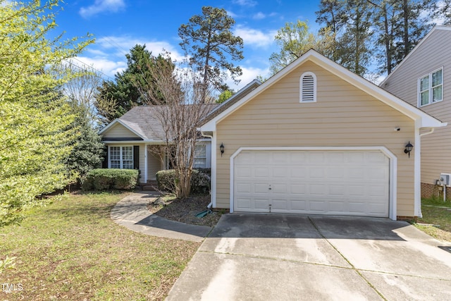 9512 Anson Grove Ln, Raleigh, NC 27615 - view of front facade with driveway and a garage