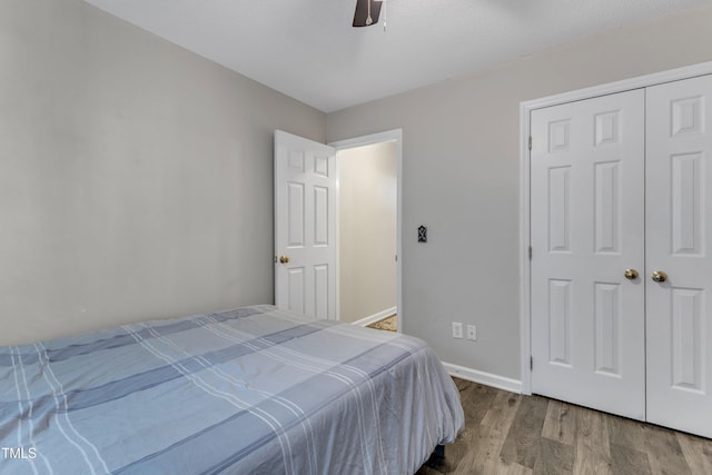 9512 Anson Grove Ln, Raleigh, NC 27615 - bedroom featuring baseboards, ceiling fan, and wood finished floors