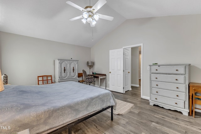 9512 Anson Grove Ln, Raleigh, NC 27615 - bedroom featuring baseboards, lofted ceiling, wood finished floors, and a ceiling fan
