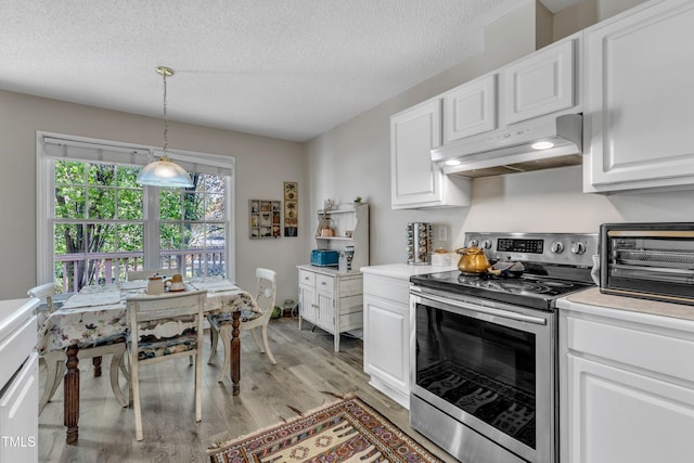 9512 Anson Grove Ln, Raleigh, NC 27615 - kitchen featuring light countertops, light wood-style flooring, stainless steel electric range oven, under cabinet range hood, and white cabinetry