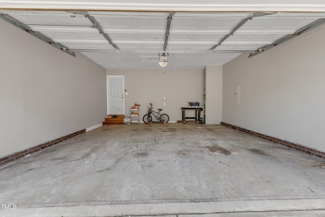 9512 Anson Grove Ln, Raleigh, NC 27615 - garage with electric panel, a garage door opener, and baseboards
