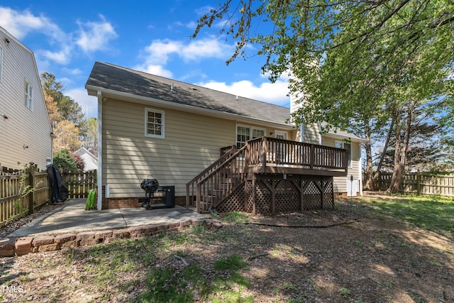 9512 Anson Grove Ln, Raleigh, NC 27615 - back of property with a fenced backyard, a wooden deck, stairway, and a patio area