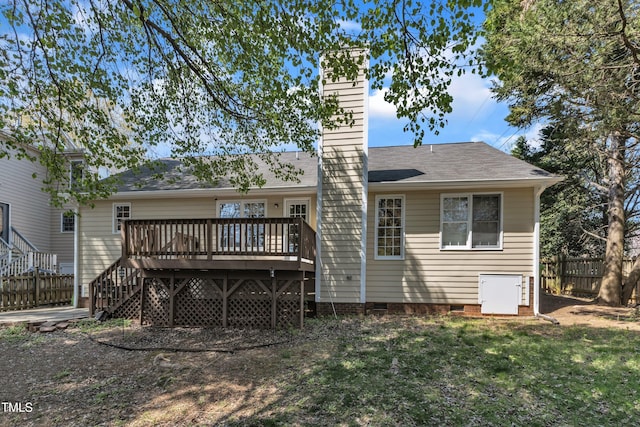 9512 Anson Grove Ln, Raleigh, NC 27615 - back of house featuring roof with shingles, fence, a lawn, a deck, and a chimney