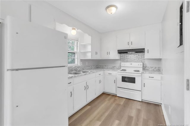 kitchen featuring white appliances, light countertops, open shelves, under cabinet range hood, and a sink